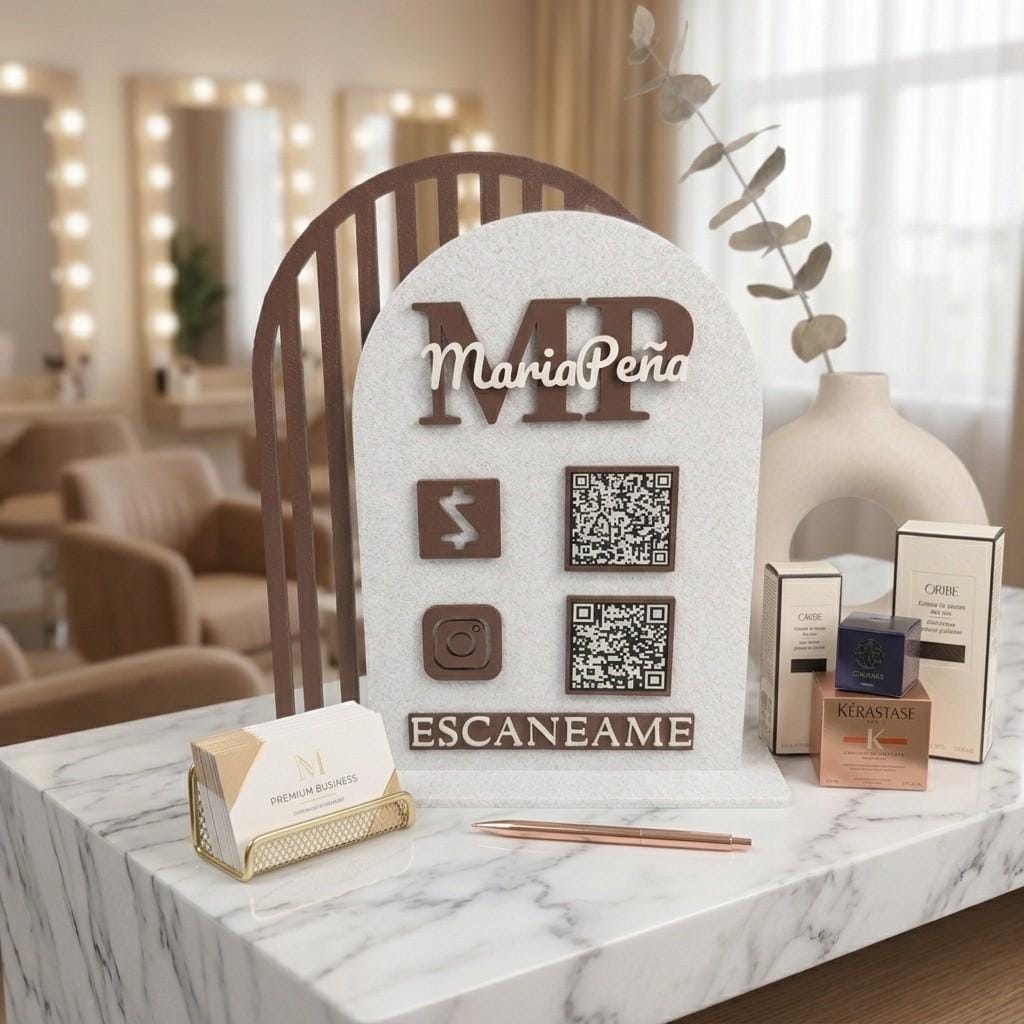 Custom QR code sign with MariaPeña MP logo, two QR codes, payment and Instagram icons, brown and white, on salon counter