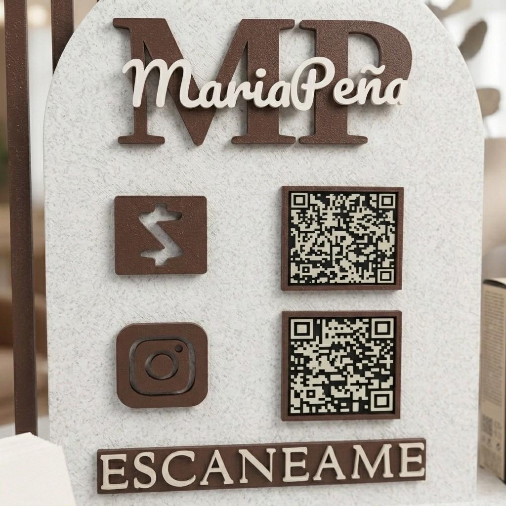 Custom QR code sign with "MariaPeña" MP logo, two QR codes, payment and Instagram icons, and ESCANEAME in brown and cream
