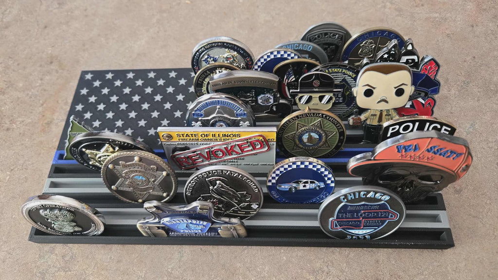 Thin Line Flag Challenge Coin Display holding police and Chicago challenge coins on a tiered black and gray flag rack