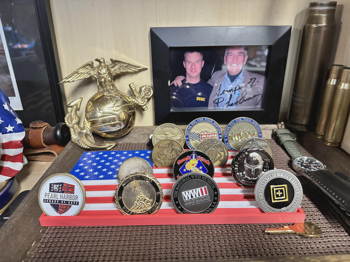 Thin Line Flag challenge coin display with American flag design holding Pearl Harbor and WWII museum coins on a shelf